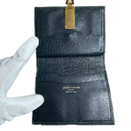 PIERRE BALMAIN Portefeuille à deux volets, orné d'un motif intégral et de finitions dorées
