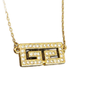 GIVENCHY Collier Givenchy, 1977, logo G, strass, or, excellent état, rare.
