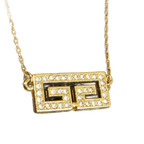 GIVENCHY Collier Givenchy, 1977, logo G, strass, or, excellent état, rare.