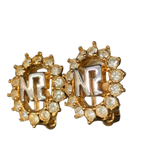 NINA RICCI Boucles d'oreilles en excellent état ornées du logo NR et de strass
