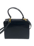 COURRÈGES Sac Uvara cuir noir lisse nœud doré