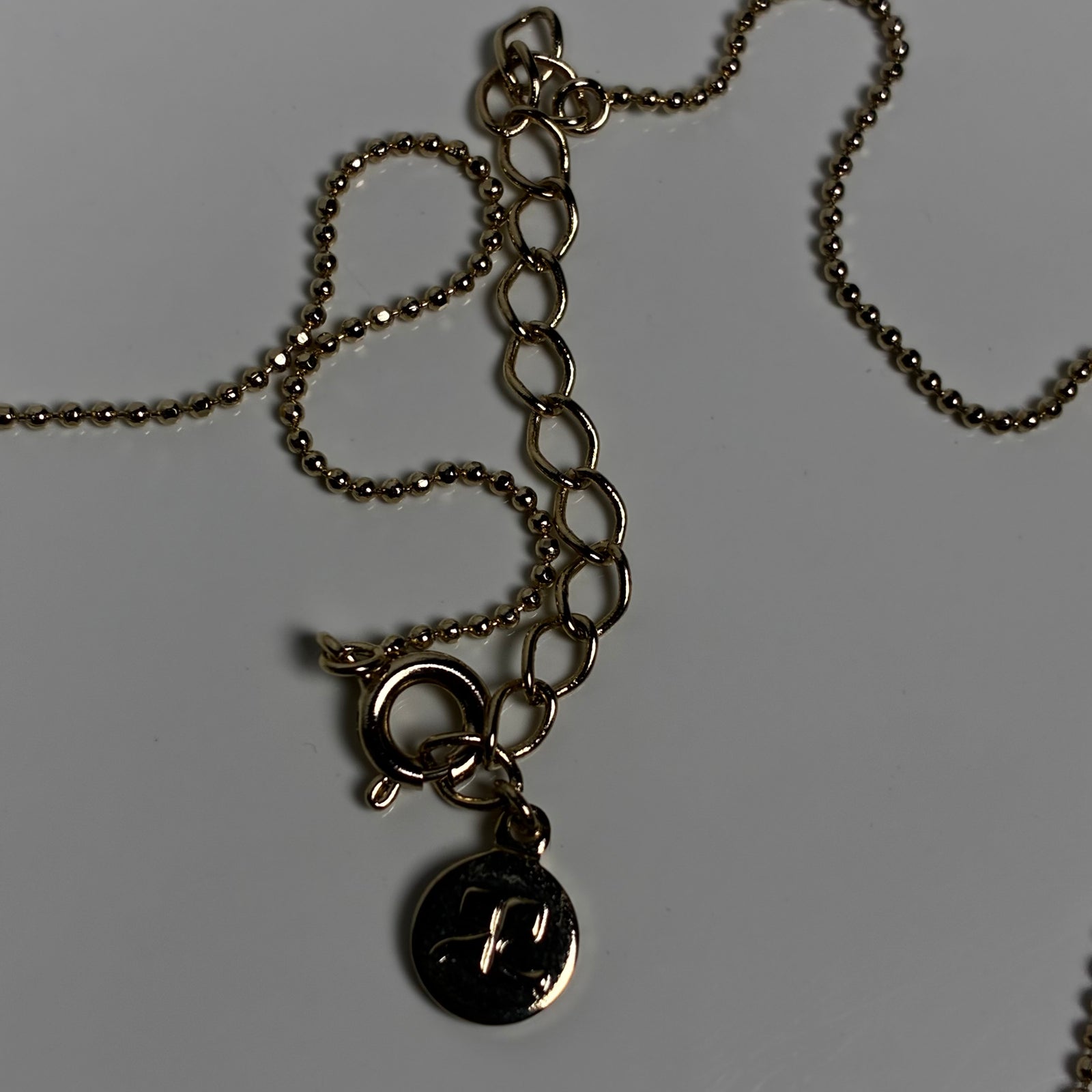 Courreges ketting met gouden bloem