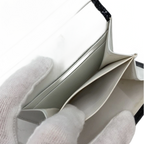 COURRÈGES Portefeuille noir cuir vernis a carreaux