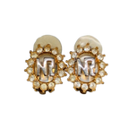 NINA RICCI Boucles d'oreilles en excellent état ornées du logo NR et de strass