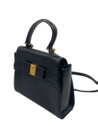 COURRÈGES Sac Uvara cuir noir lisse nœud doré