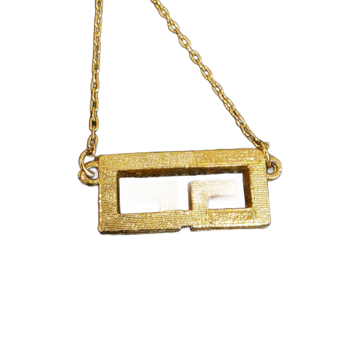 GIVENCHY Collier Givenchy, 1977, logo G, strass, or, excellent état, rare.