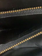COURRÈGES Sac Uvara cuir noir lisse nœud doré