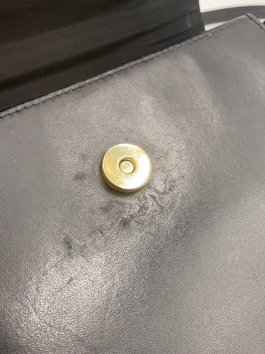 COURRÈGES Sac Uvara cuir noir lisse nœud doré