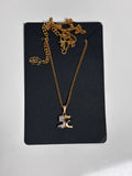 Courrèges Paris Initial AC pendant necklace