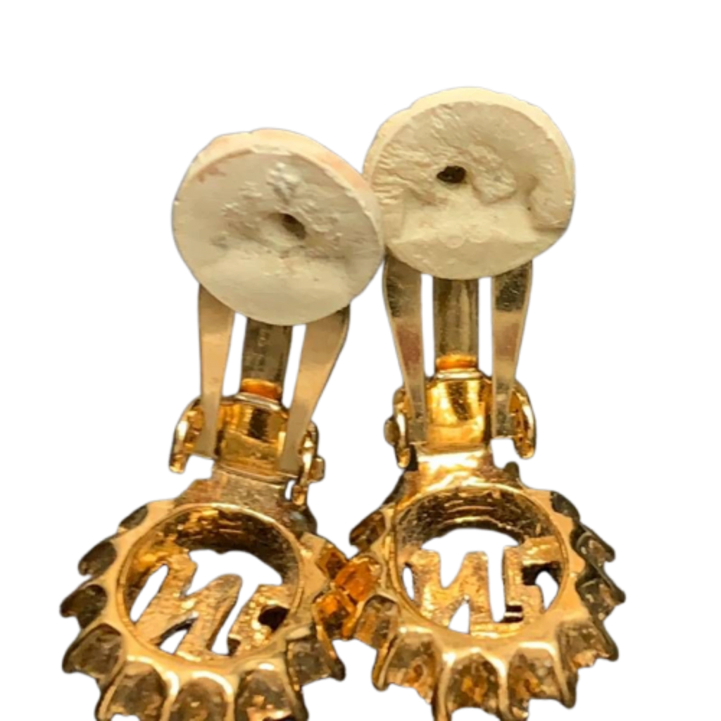 NINA RICCI Boucles d'oreilles en excellent état ornées du logo NR et de strass