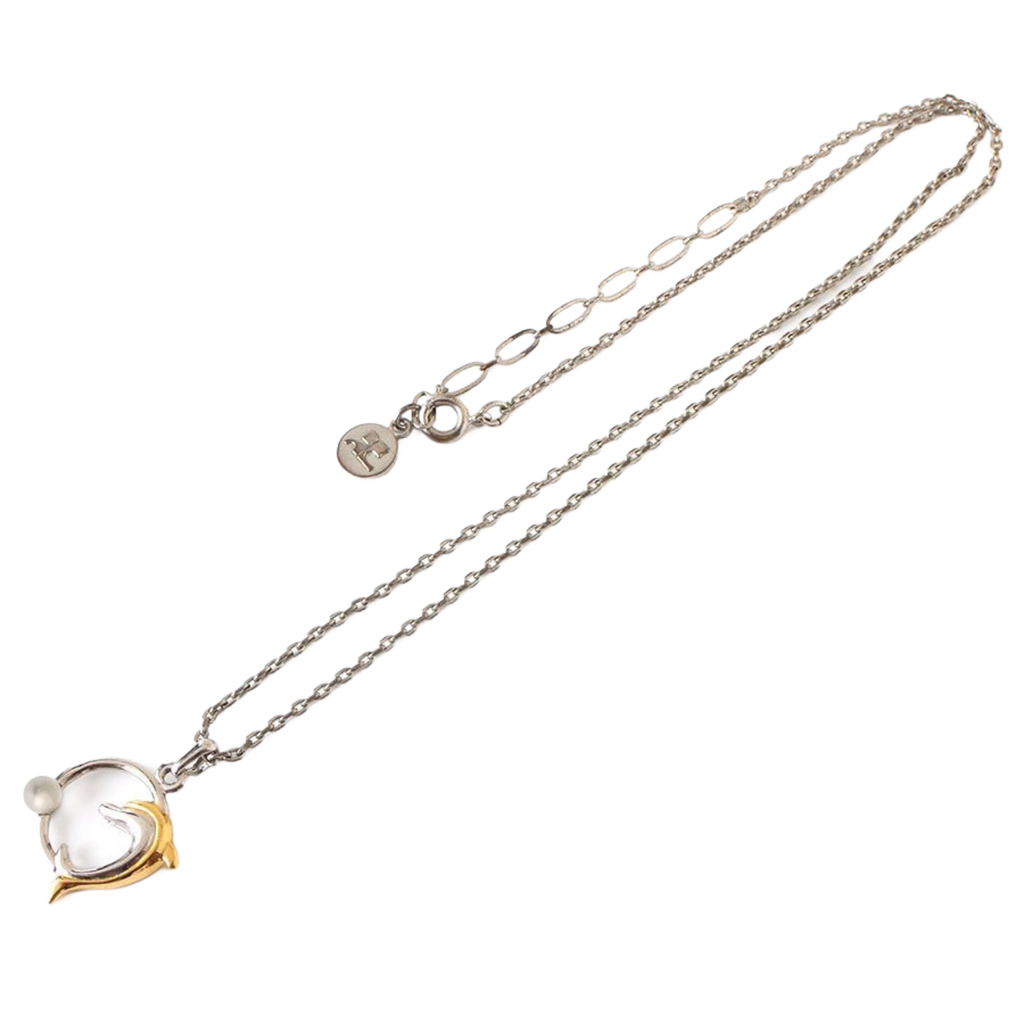 COURRÈGES Collier pendentif motif dauphin argent et or