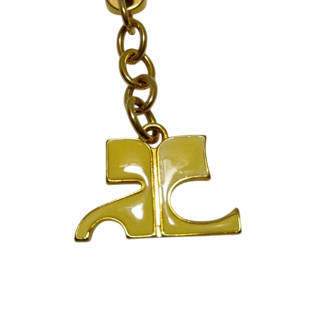 COURRÈGES Porte-clé logo AC émail jaune métal doré étiquette d'origine