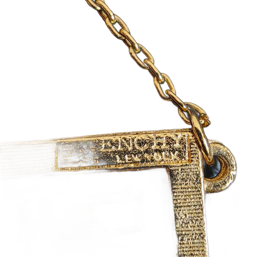GIVENCHY Collier Givenchy, 1977, logo G, strass, or, excellent état, rare.
