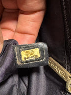 CHANEL Sac cabas Chanel New Travel Line en toile noire monogramme CC